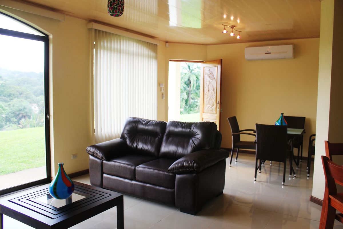 Bright living and dining area of a holiday rental apartment