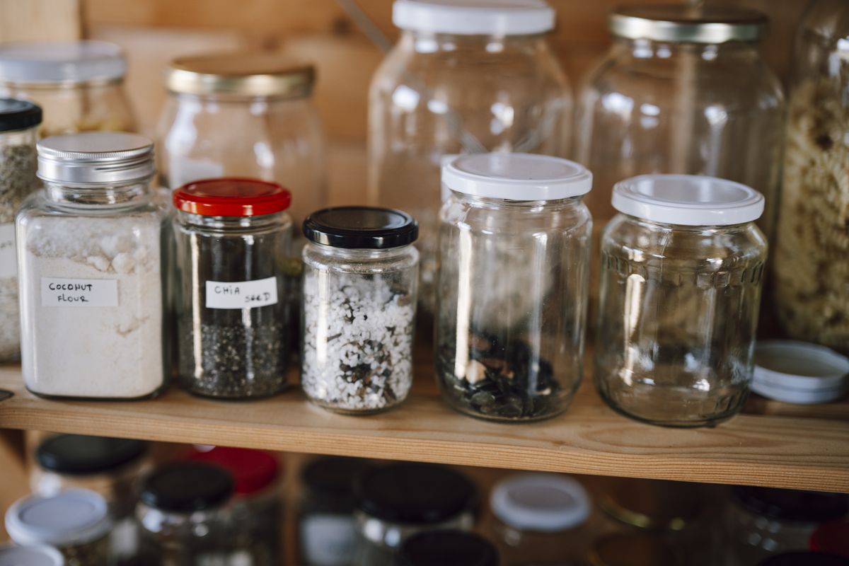 A home pantry with food stored in sealed jars and containers, which keeps stored produce and grains from attracting fruit flies