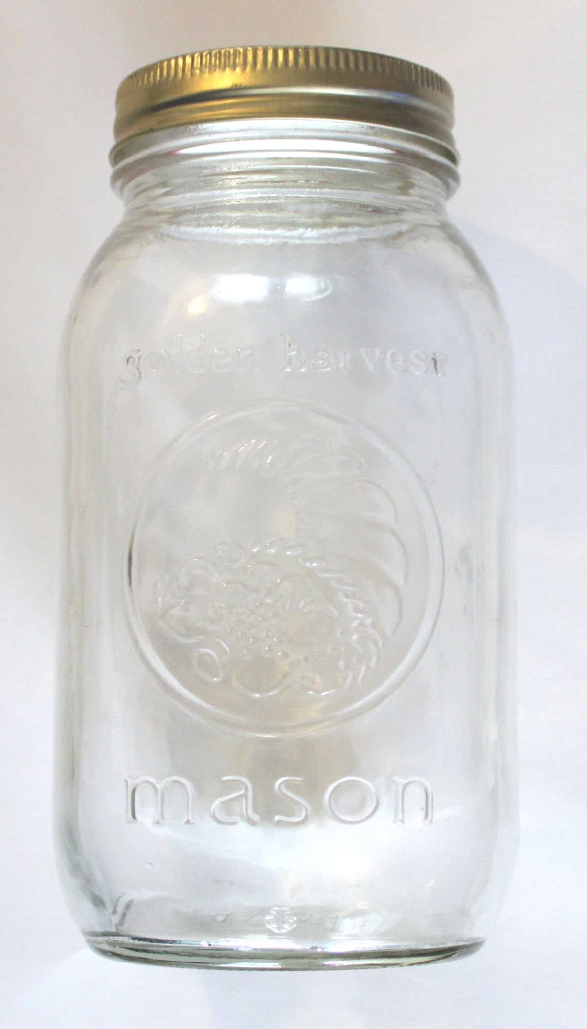 A jar used to build an apple cider vinegar fruit fly trap