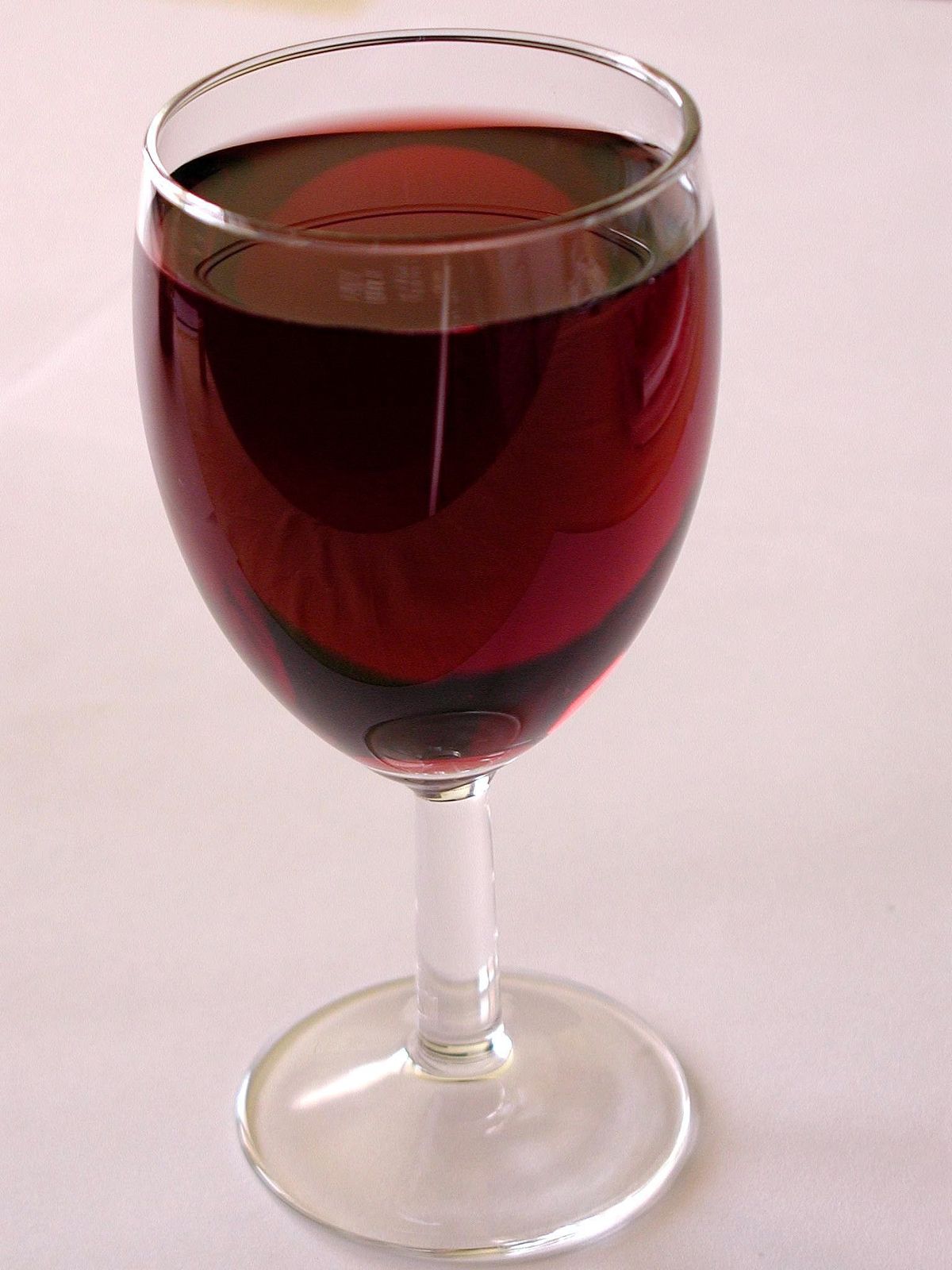 A glass of red wine, an attractive bait for a homemade fruit fly trap